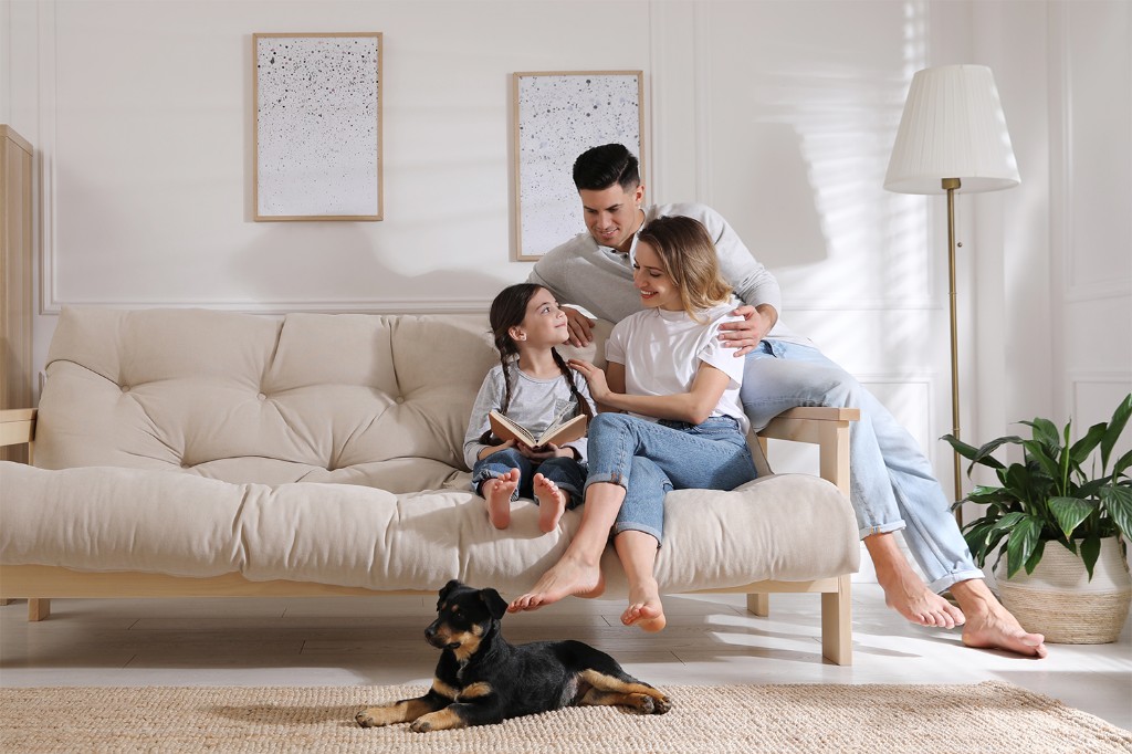 Family at home with their puppy